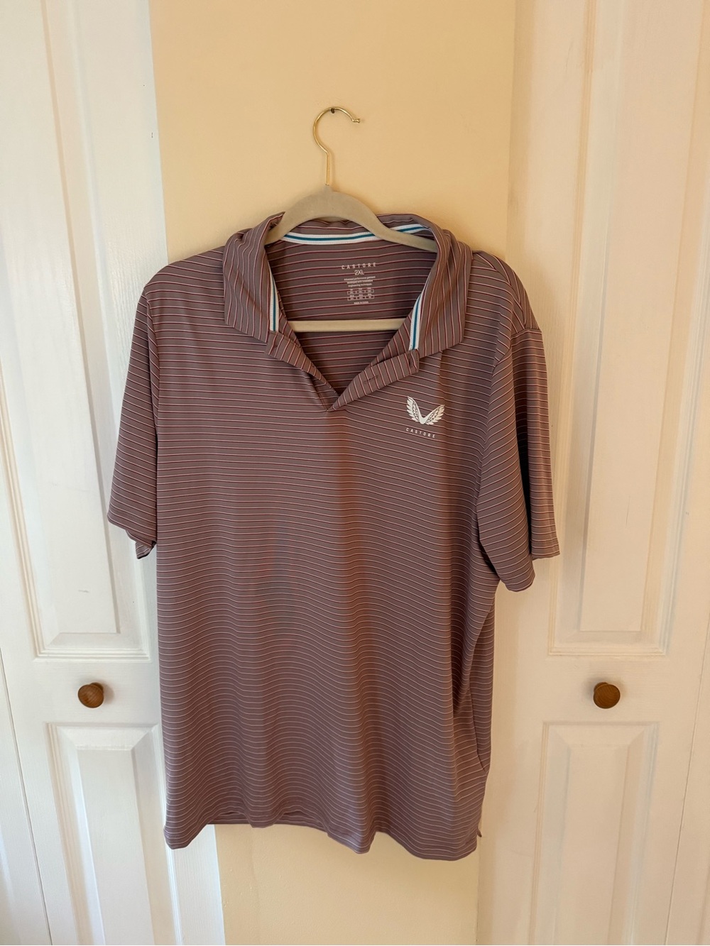 Castore Men's Striped Mauve Performance golf Polo